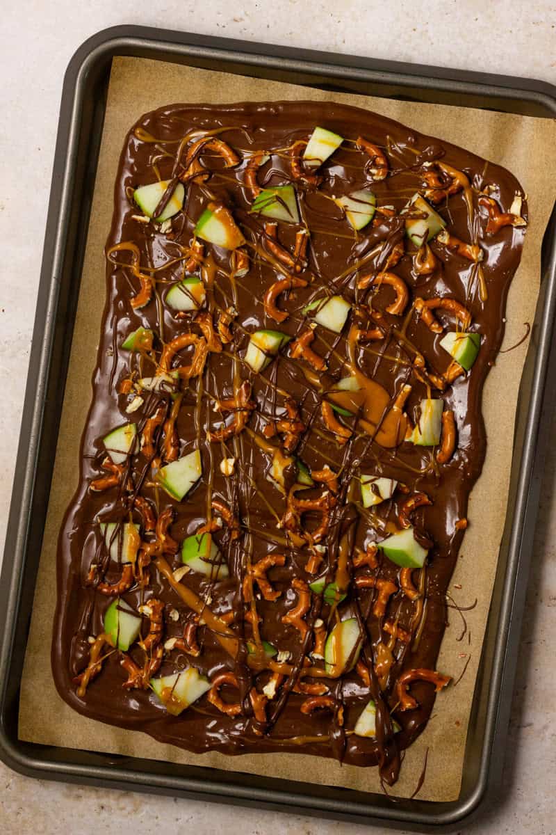 Chocolate with pretzel pieces, green apple chunks, and caramel and chocolate drizzle.