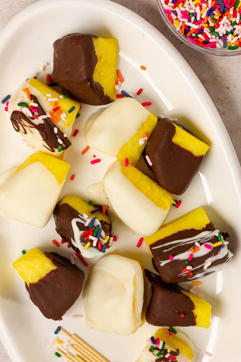 chocolate covered pineapple on white plate
