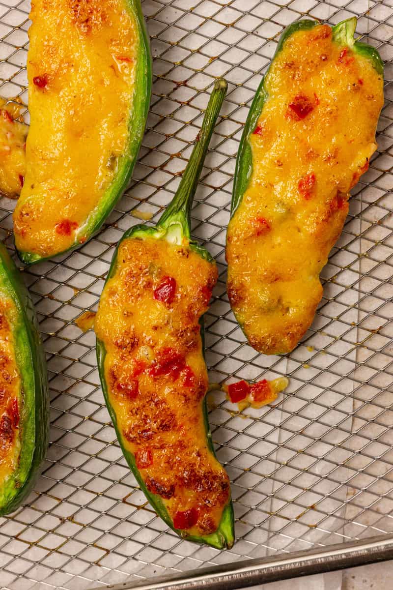 pimento cheese jalapeno poppers on an air fryer rack