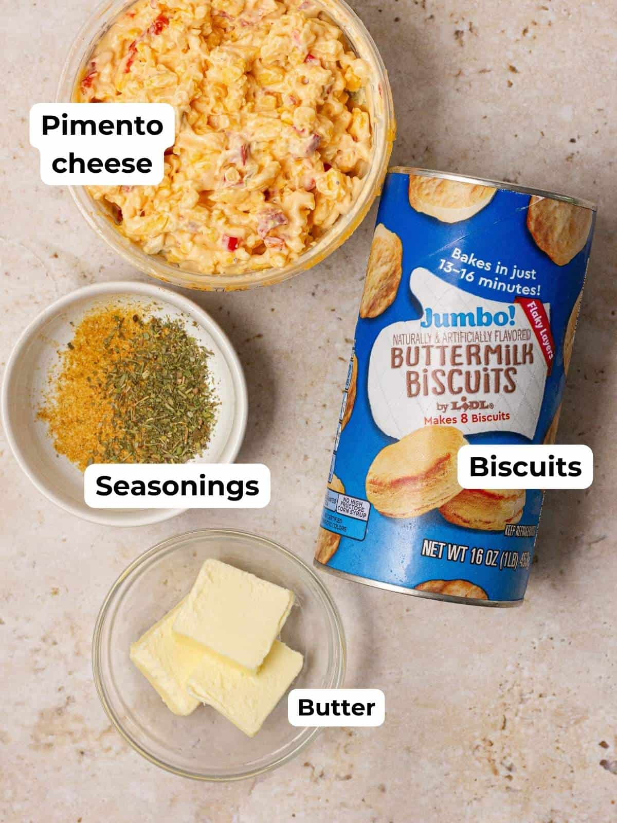a bowl of pimento cheese perfect for creating cheese bombs, a can of buttermilk biscuits