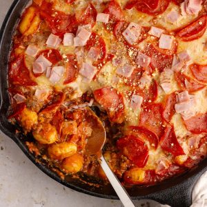 A close-up of the finished Pizza Gnocchi, highlighting the gooey cheese, crispy pepperoni, and tender gnocchi.
