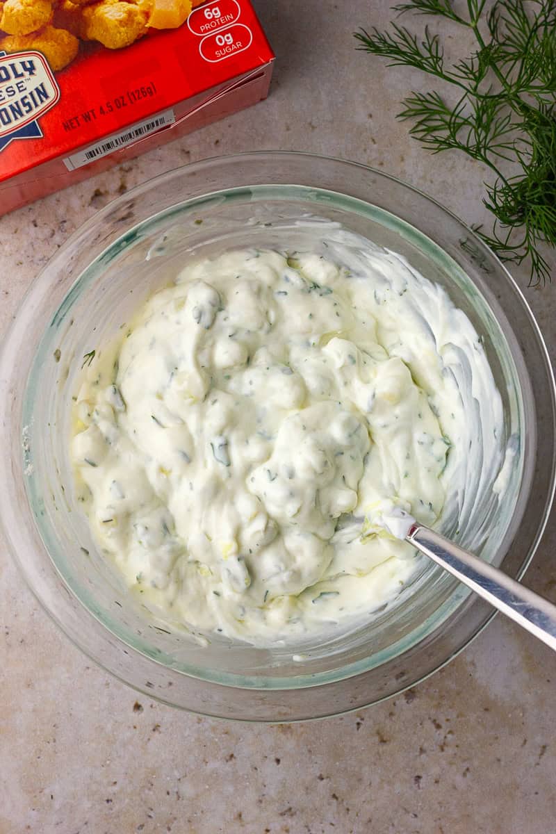 Mixed Southern Fried Pickle Dip ingredients in a bowl, smooth and creamy texture.