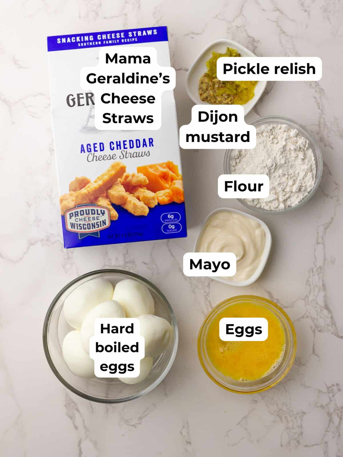 Labeled ingredients for air fryer deviled eggs including cheese straws, flour, eggs, and mayo.