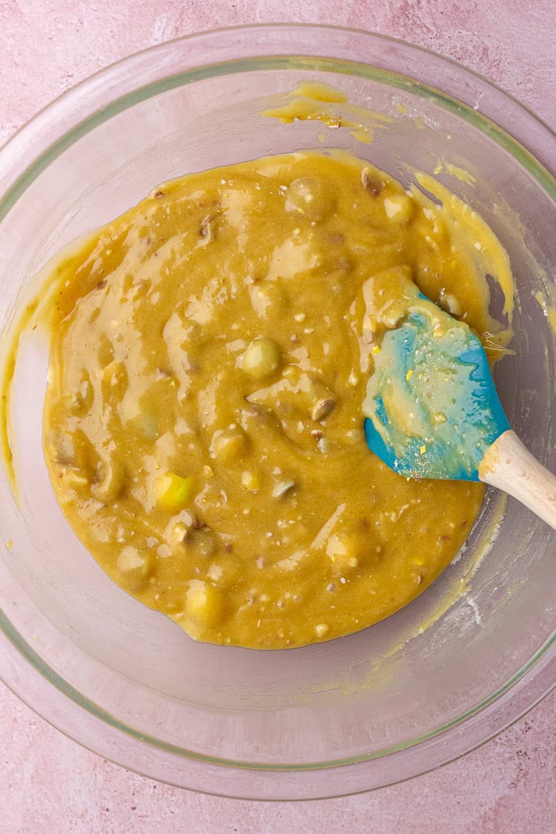 The finished cookie dough is fully mixed with chopped mini Cadbury eggs, ready to be spread into the pan.