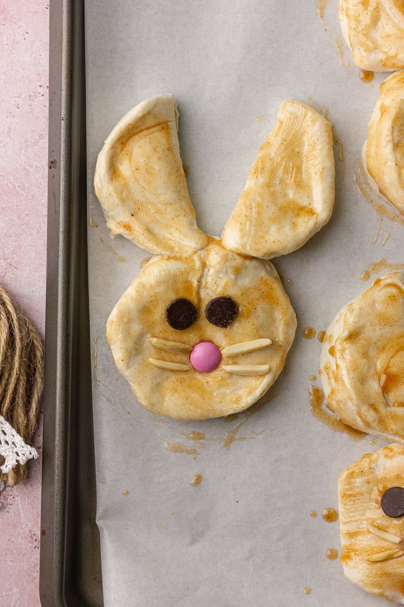 Fully assembled unbaked bunny biscuit with decorations before baking.