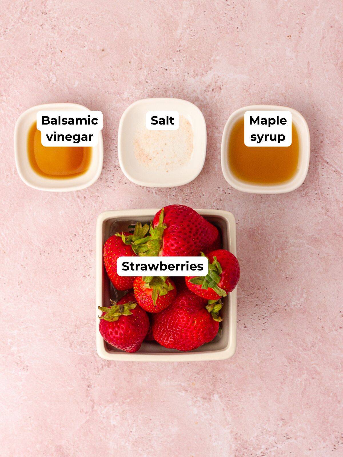 Balsamic vinegar, salt, maple syrup, and strawberries are shown as the recipe ingredients.