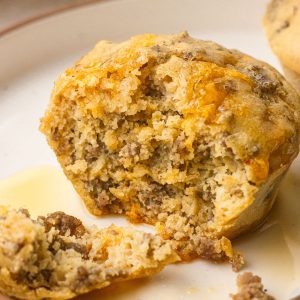 Close up featured image of a protein McGriddle bite with maple syrup.