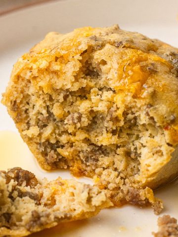 Close up featured image of a protein McGriddle bite with maple syrup.