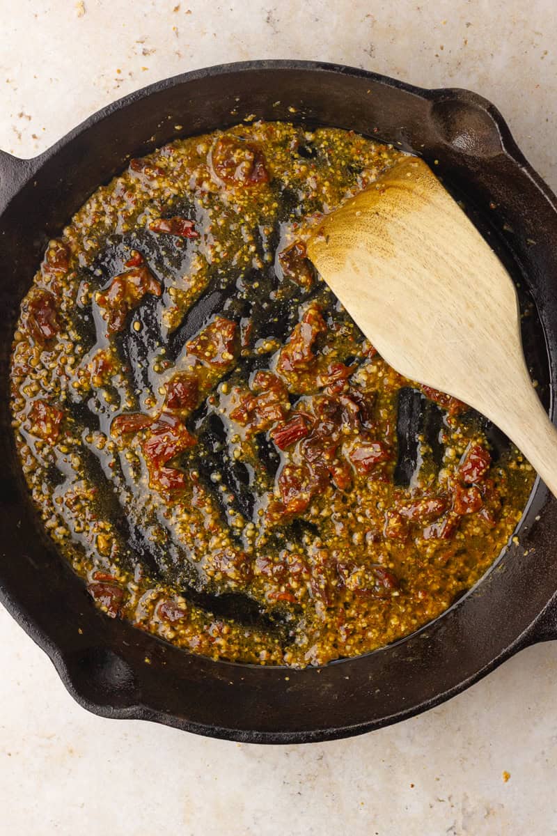 Sun-dried tomatoes and Dijon mustard simmering in the skillet to start the sauce.