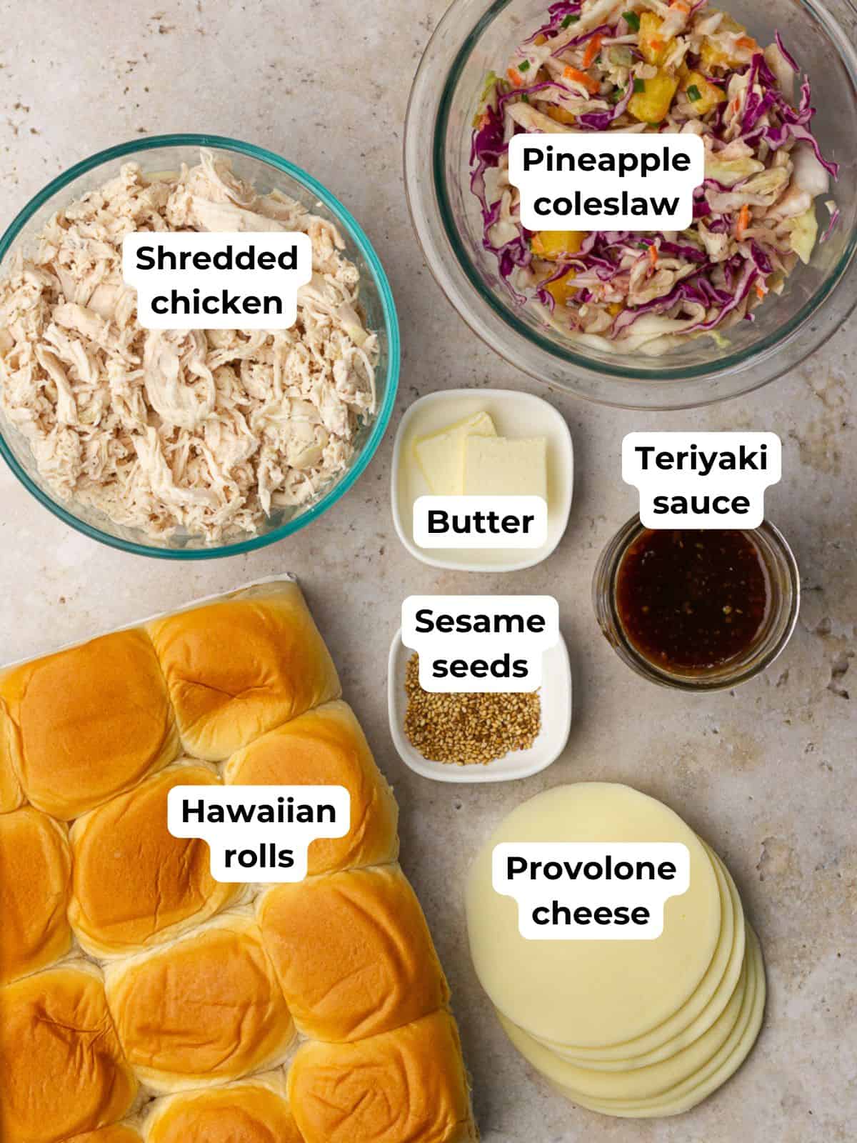 Ingredients labeled on a counter include Hawaiian rolls, shredded chicken, pineapple coleslaw, teriyaki sauce, butter, sesame seeds, and provolone.