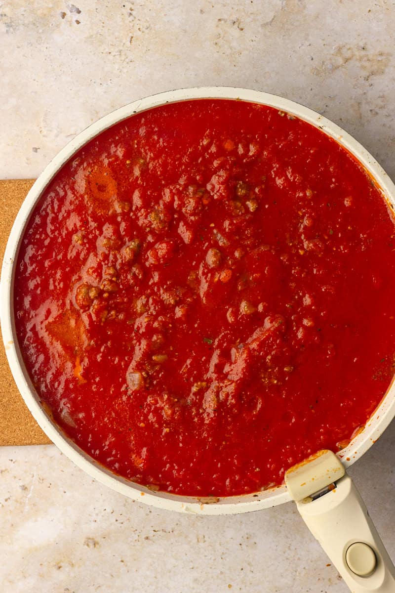 Meaty tomato sauce simmers in a wide skillet until thick and bubbly.
