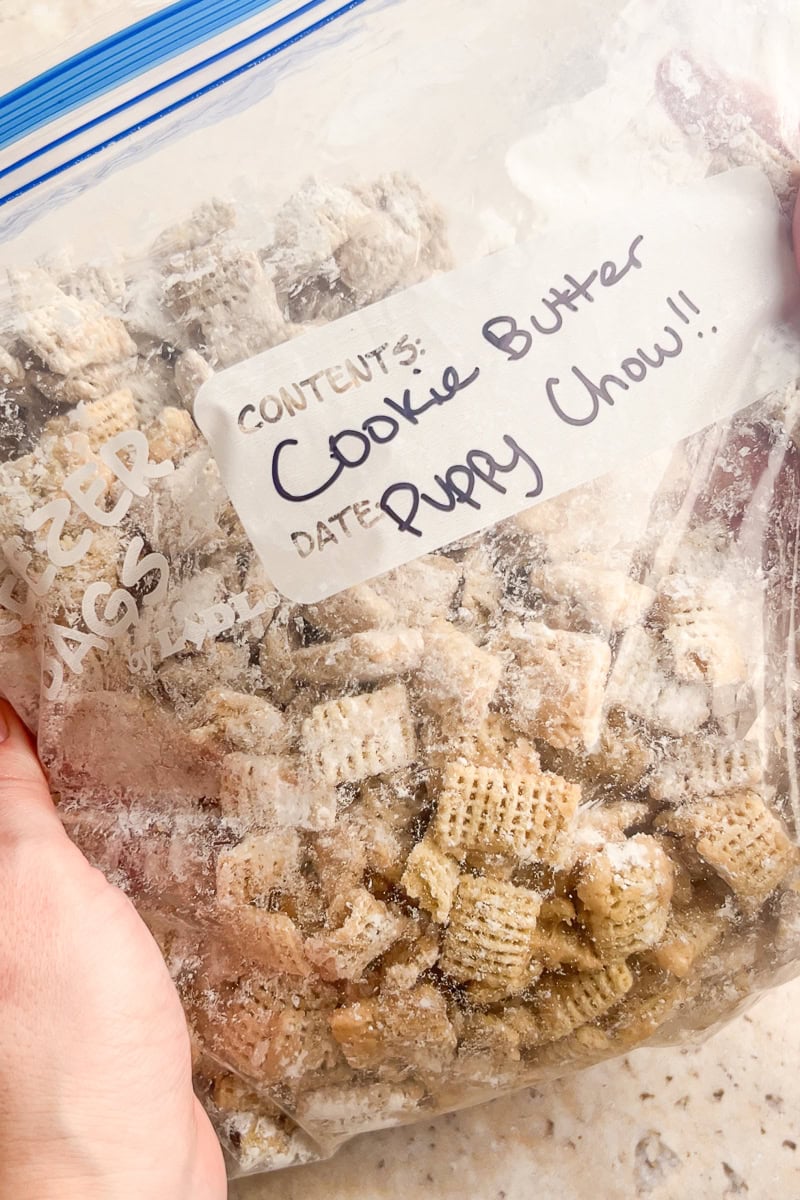 A labeled freezer bag filled with cookie butter puppy chow, ready for storage or make-ahead snacking.