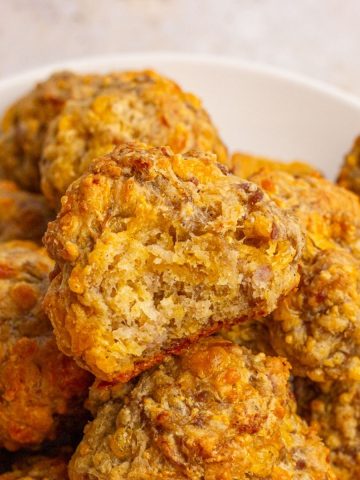 A close-up shot of sausage balls showing their golden, cheesy texture.
