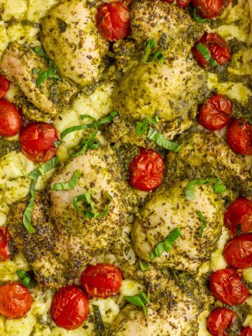 Caprese pesto chicken rice bake with juicy chicken, melted mozzarella, and roasted tomatoes in one dish.