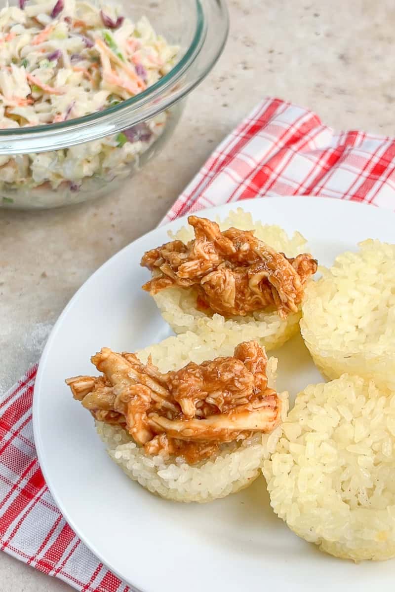 BBQ chicken is added to baked crispy rice cups before topping with slaw.
