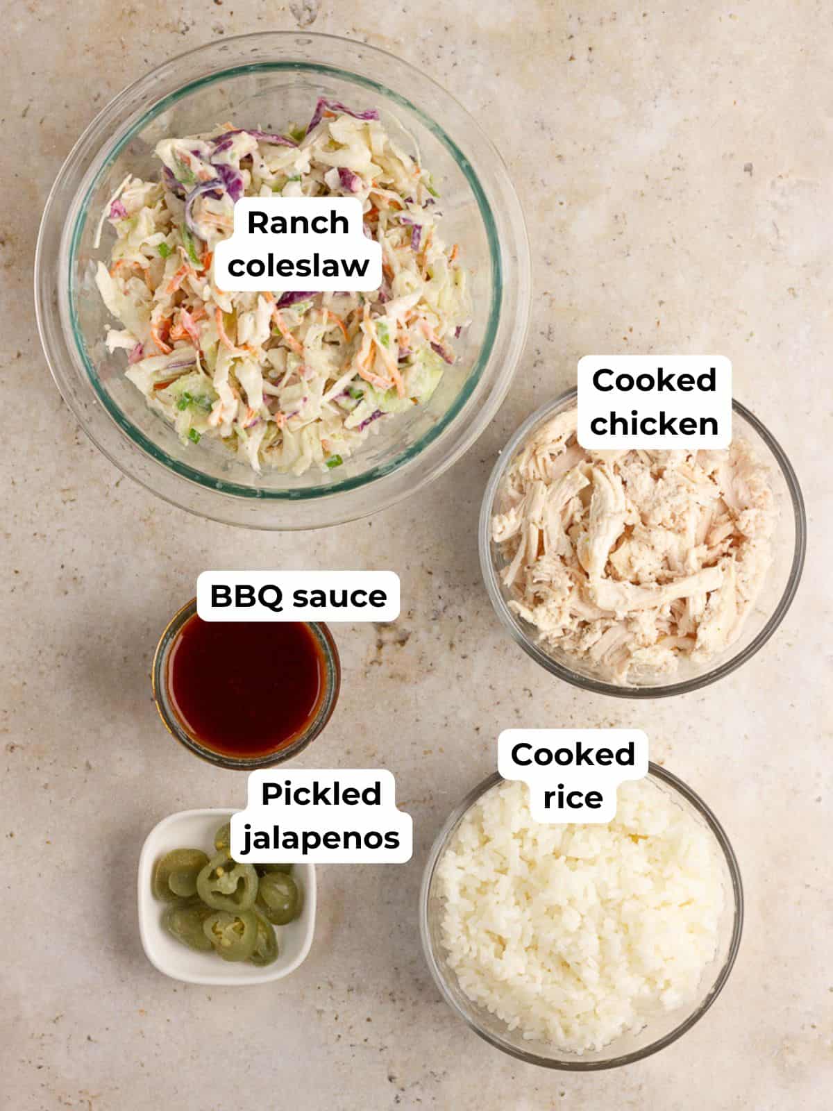 Ingredients for BBQ chicken crispy rice cups, including cooked rice, chicken, BBQ sauce, ranch coleslaw, and pickled jalapeños.